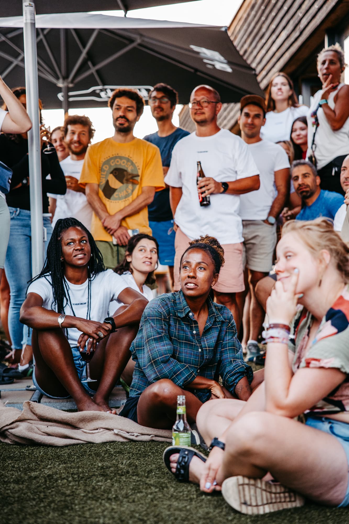 Camp participants socializing on lodge terrace